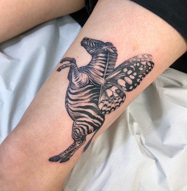 Neat Zebra Tattoo On Female