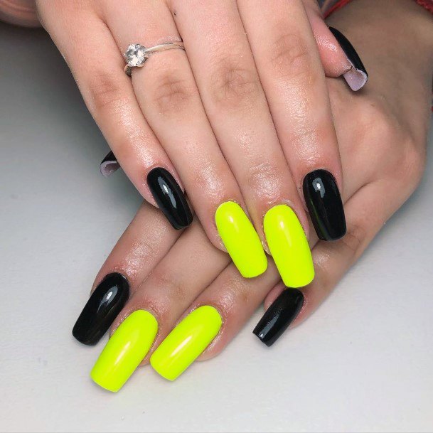 Neon Yellow And Black Colored Nails