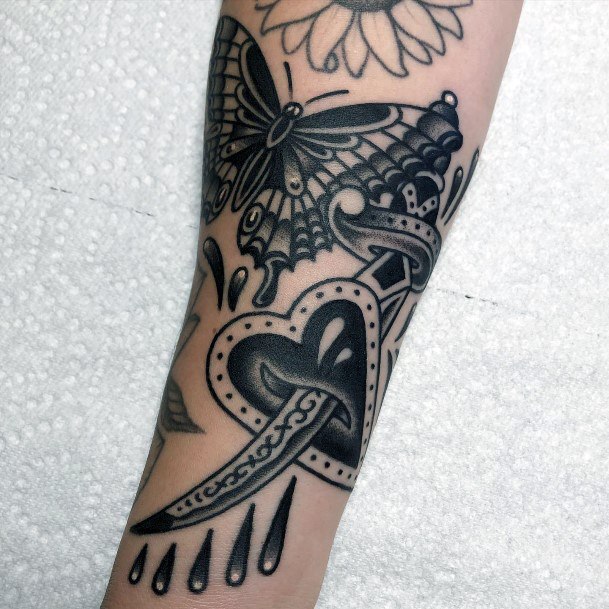 Nice Dagger Heart Tattoos For Women