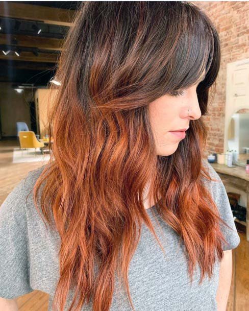 Nice Wavy Red Hairstyle With Side Bangs For Square Faced Girls