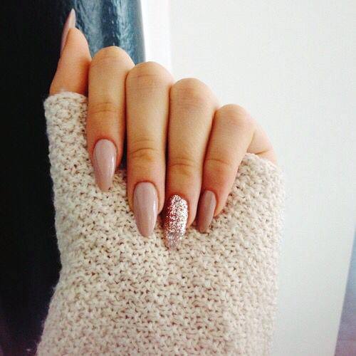 Nude Nails And A Pink Glitter Accent Almond Shape