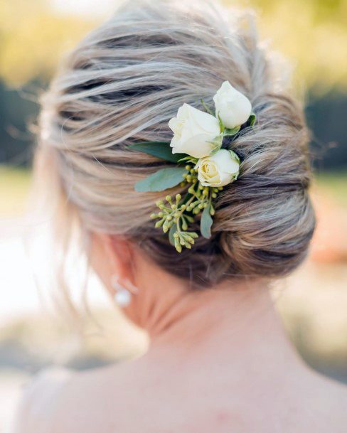 Older Woman With A Flowery Bridesmaid French Twist