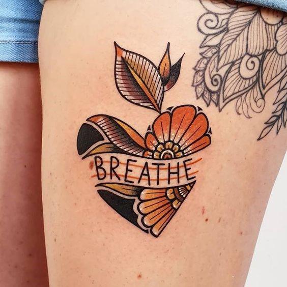 Orange And Dark Heart Breathe Tattoo Womens Thighs