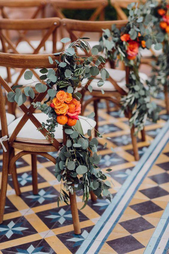 Orange And Green September Wedding Flowers On Chair