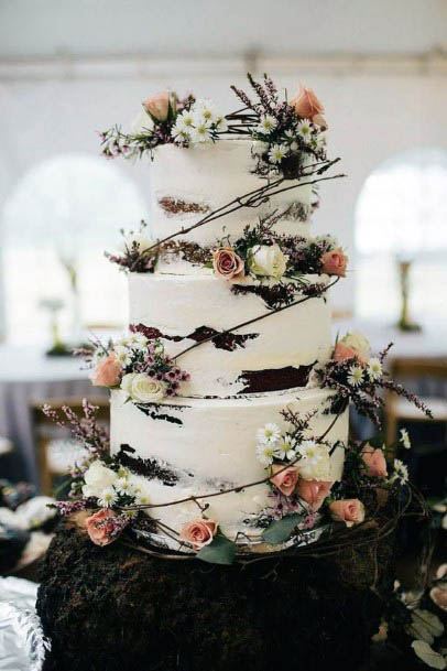 Orange And White Rustic Flowers On Wedding Cake