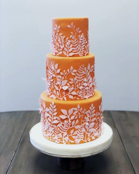 Orange Cake With Unique White Design Wedding