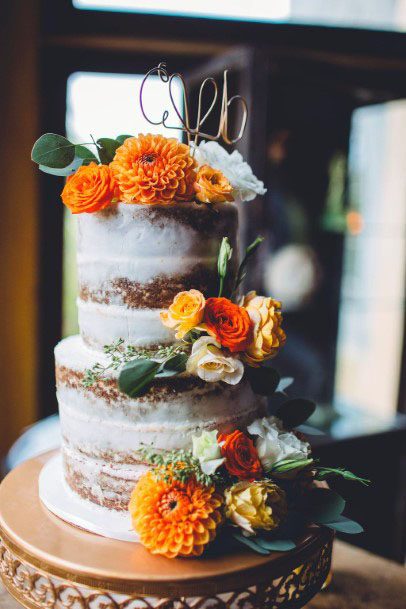 Orange Marigold November Wedding Flowers On Cake