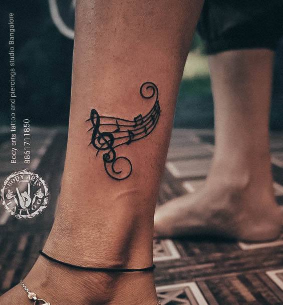 Ornate Tattoos For Females Music Note