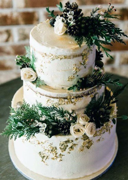 Outstanding Winter White Wedding Cake Greenery Gold Flakes Ideas