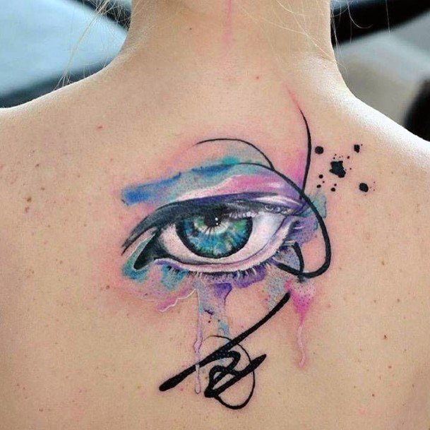 Pale Colored Eye Tattoo For Women On Back