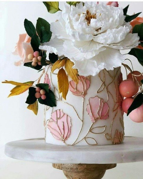 Pink Embossed Flowers On Beautiful Wedding Cake