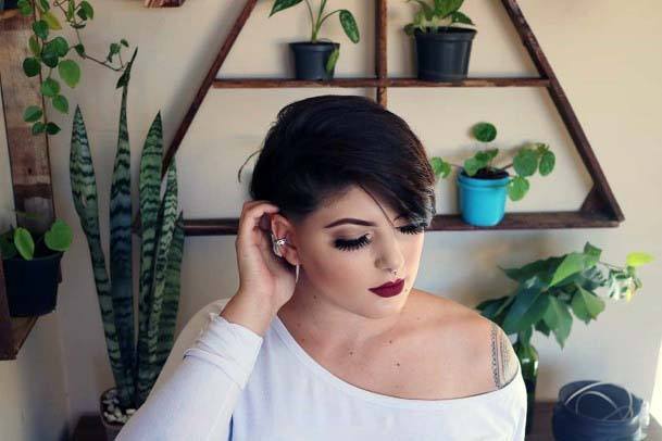 Pixie Hairstyle Burgundy Color With Hair Tucked Behind Ear