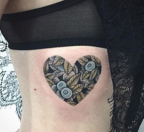 Pleasing Black And Blue Flowers In Heart Tattoo Womens Torso
