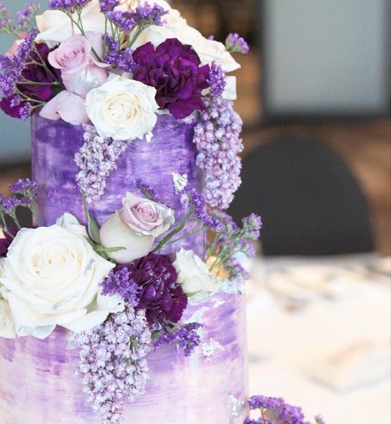 Plethora Of Purple Flowers Wedding Cake