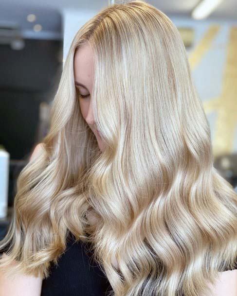 Polished Princess Blonde Long Textured Wavy Womens Hairstyle Idea