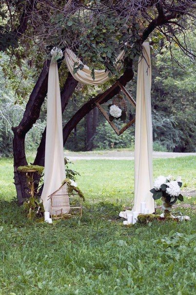 Popular Wedding Sleek White Valance Drape Over Tree Blooming Bouquet Backdrop Ideas