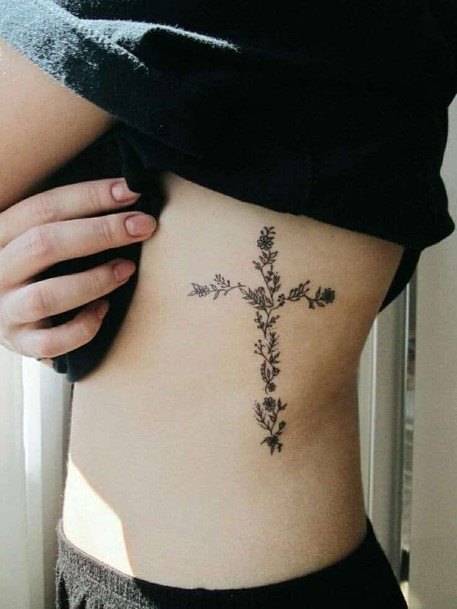 Pretty Flowers Making Up A Cross Tattoo Torso Women