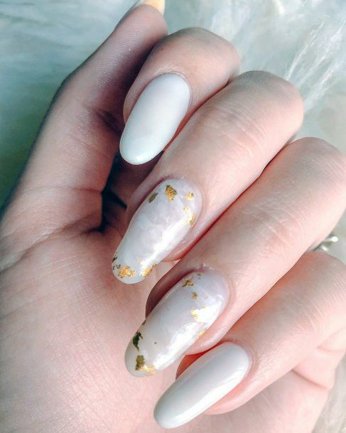 Pure White Nail Polish With Specks Of Gold