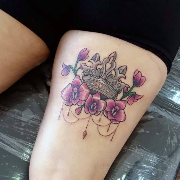 Purple Flowers And Crown Tattoo Womens Thighs