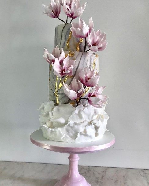 Purple Long Stemmed Flowers On Beautiful Wedding Cake
