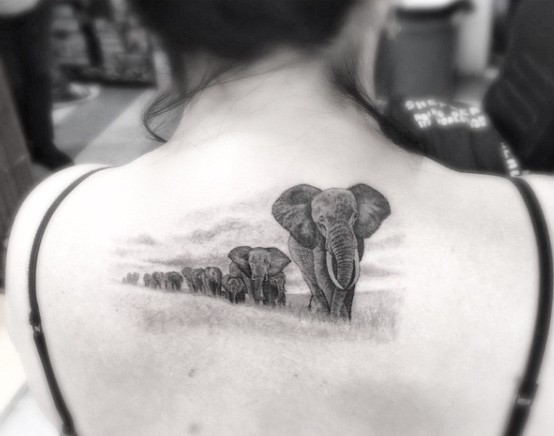 Queue Of Elephants Tattoo Womens Back