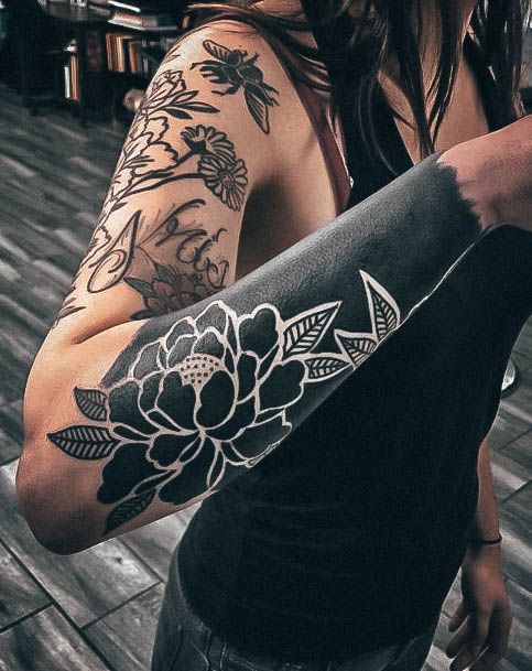 Ravishing Blackout Tattoo On Female