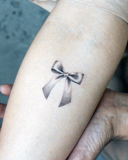 Ravishing Bow Tattoo On Female