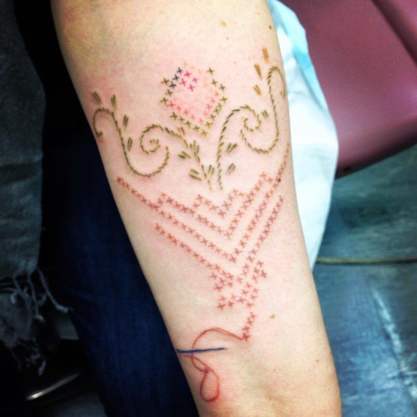 Ravishing Cross Stitch Tattoo On Female