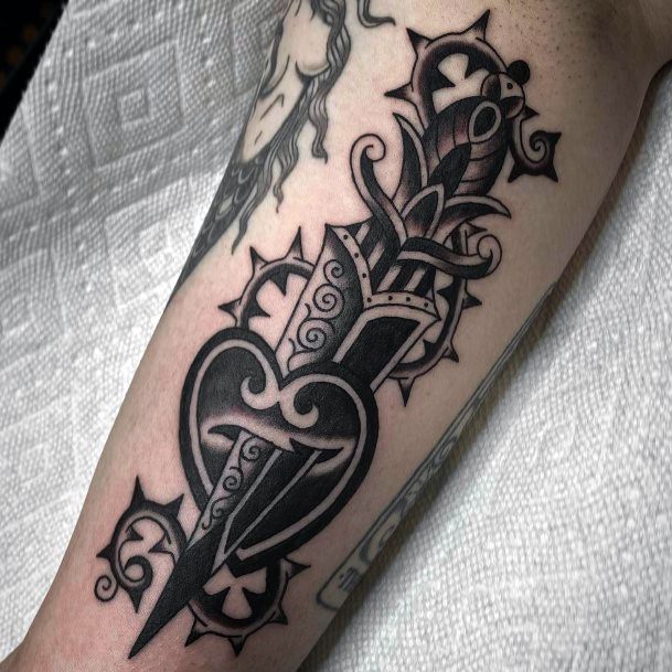 Ravishing Dagger Heart Tattoo On Female