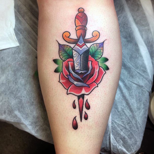 Ravishing Dagger Rose Tattoo On Female