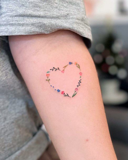 Ravishing Flower Heart Tattoo On Female