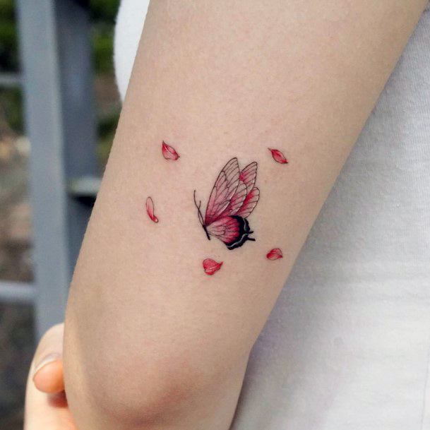 Ravishing Flower Petal Tattoo On Female