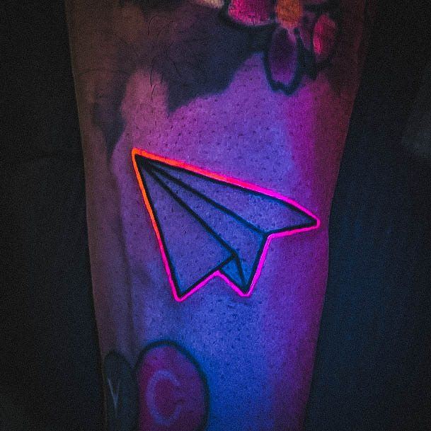 Ravishing Glow In The Dark Tattoo On Female Paper Airplane