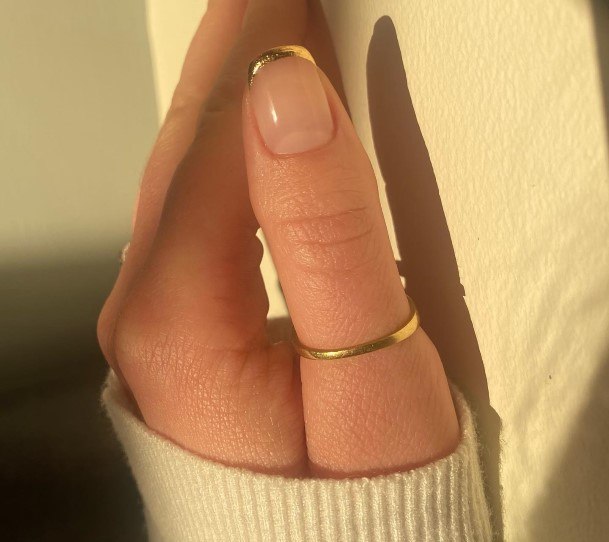 Ravishing Gold French Tip Nail On Female