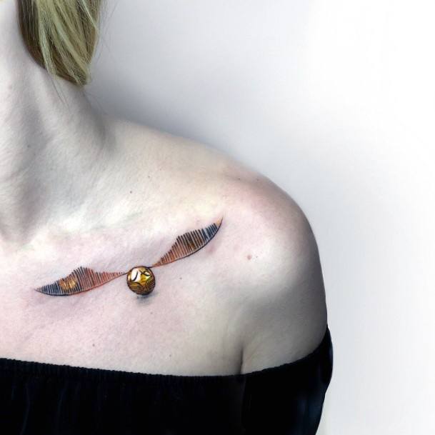 Ravishing Golden Snitch Tattoo On Female