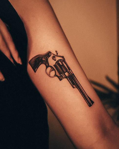 Ravishing Gun Tattoo On Female