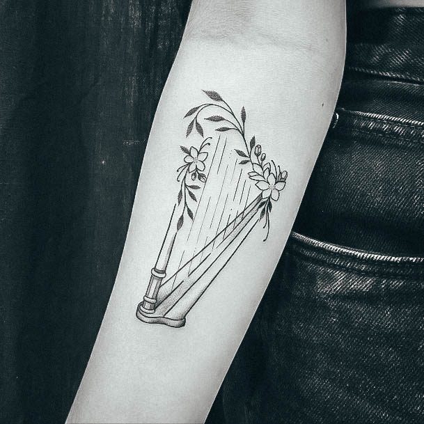 Ravishing Harp Tattoo On Female