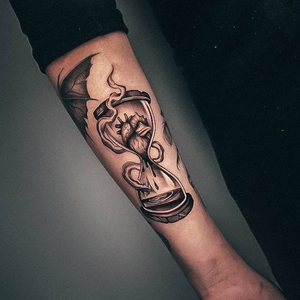 Ravishing Hourglass Tattoo On Female