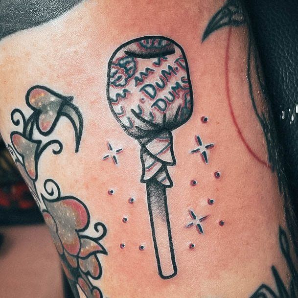 Ravishing Lollipop Tattoo On Female