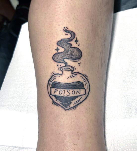 Ravishing Poison Bottle Tattoo On Female