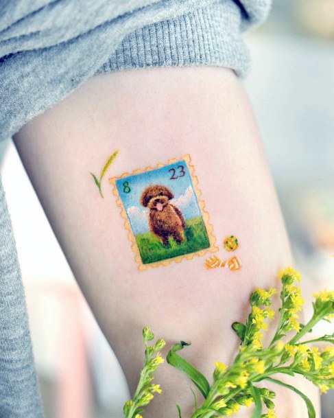 Ravishing Postage Stamp Tattoo On Female