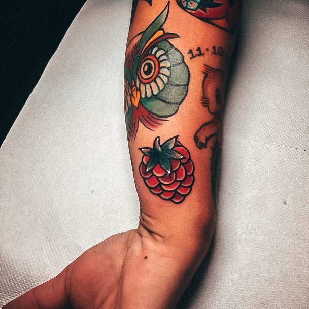 Ravishing Raspberry Tattoo On Female