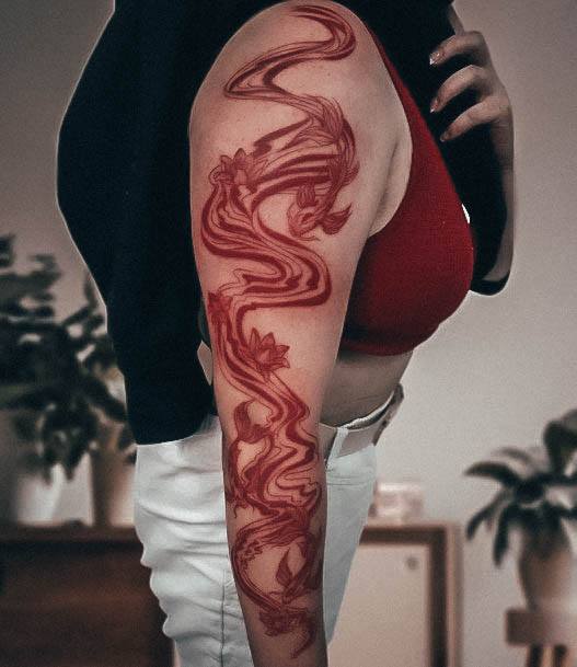 Ravishing Red Ink Tattoo On Female