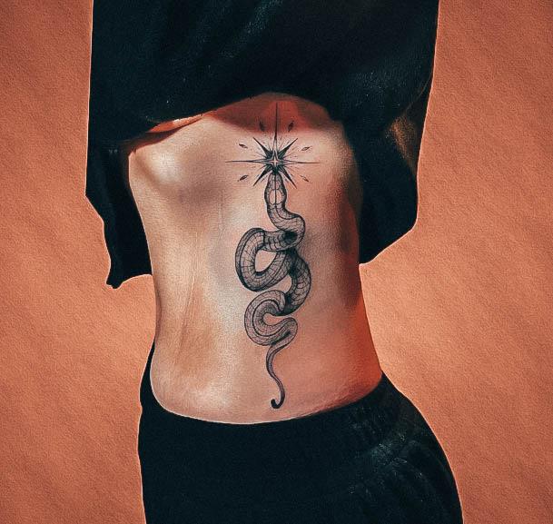 Ravishing Rib Tattoo On Female