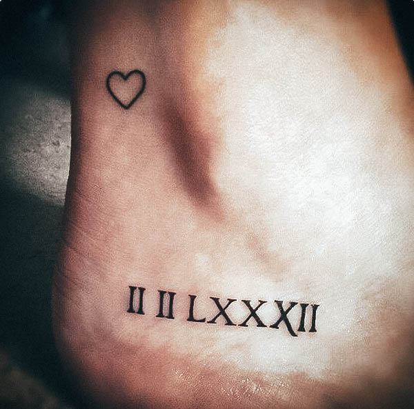 Ravishing Roman Numeral Tattoo On Female