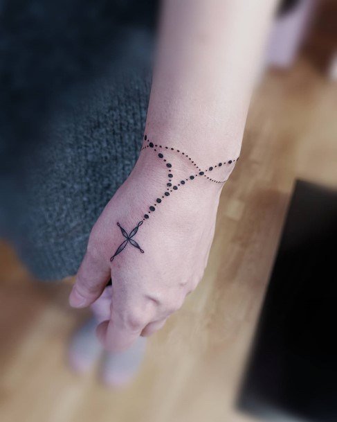 Ravishing Rosary Tattoo On Female