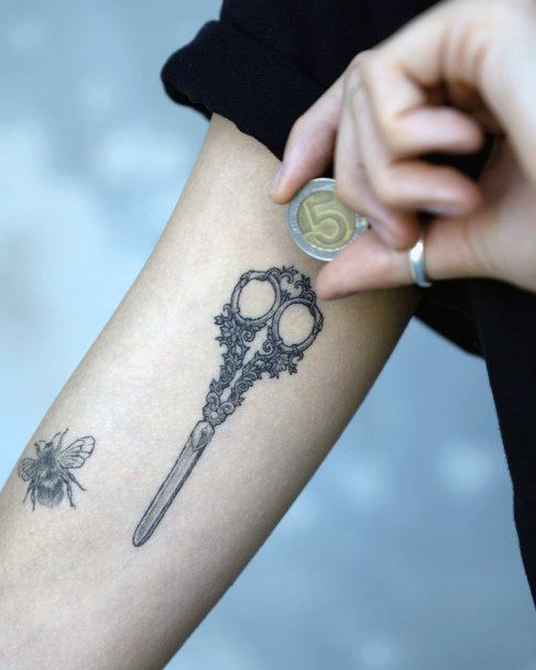 Ravishing Scissors Tattoo On Female