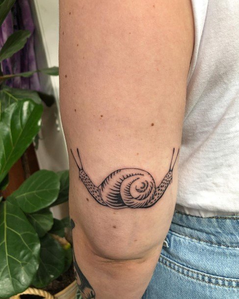 Ravishing Snail Tattoo On Female