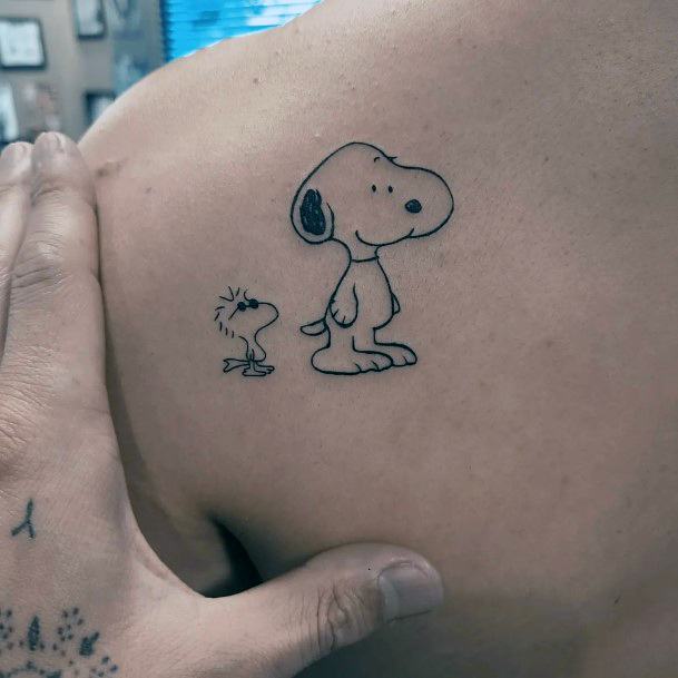 Ravishing Snoopy Tattoo On Female