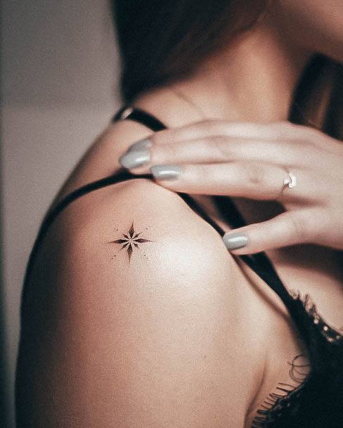 Ravishing Star Tattoo On Female Upper Shoulder Simple
